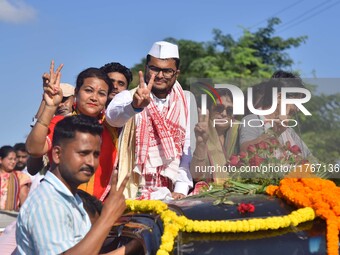 Congress candidate from the Samaguri constituency, Tanzil Hussain, participates in a roadshow during an election campaign rally ahead of the...