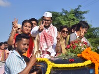 Congress candidate from the Samaguri constituency, Tanzil Hussain, participates in a roadshow during an election campaign rally ahead of the...