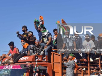 Supporters of Congress candidate Tanzil Hussain from the Samaguri constituency participate in a roadshow during an election campaign rally a...