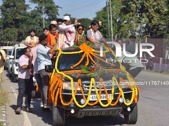 Congress candidate from the Samaguri constituency, Tanzil Hussain, participates in a roadshow during an election campaign rally ahead of the...