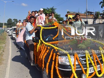 Congress candidate from the Samaguri constituency, Tanzil Hussain, participates in a roadshow during an election campaign rally ahead of the...