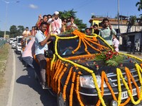 Congress candidate from the Samaguri constituency, Tanzil Hussain, participates in a roadshow during an election campaign rally ahead of the...