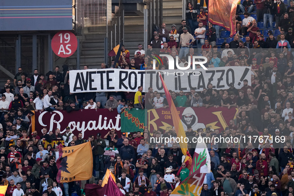 Supporters of AS Roma show a banner against the AS Roma society during the Serie A Enilive match between AS Roma and Bologna FC at Stadio Ol...