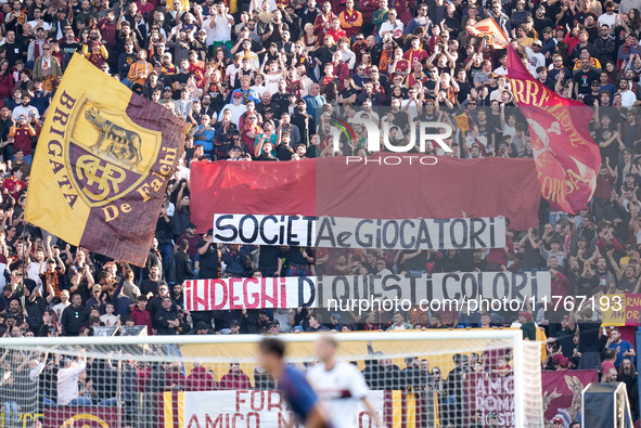 Supporters of AS Roma show a banner against society during the Serie A Enilive match between AS Roma and Bologna FC at Stadio Olimpico on No...