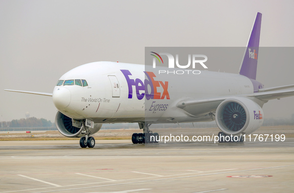 Flight FX5286 operated by FedEx lands at Qingdao Jiaodong International Airport in Qingdao, China, on November 11, 2024. 