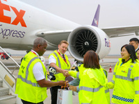 In Qingdao, China, on November 11, 2024, FedEx and airport staff present gifts to the crew. (