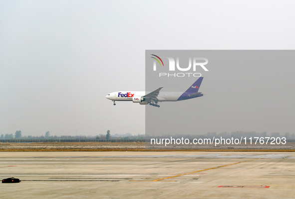 Flight FX5286 operated by FedEx lands at Qingdao Jiaodong International Airport in Qingdao, China, on November 11, 2024. 