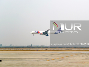 Flight FX5286 operated by FedEx lands at Qingdao Jiaodong International Airport in Qingdao, China, on November 11, 2024. (