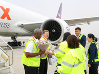 In Qingdao, China, on November 11, 2024, FedEx and airport staff present gifts to the crew. (