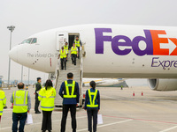 Crew members slowly step off the plane in Qingdao, China, on November 11, 2024. (