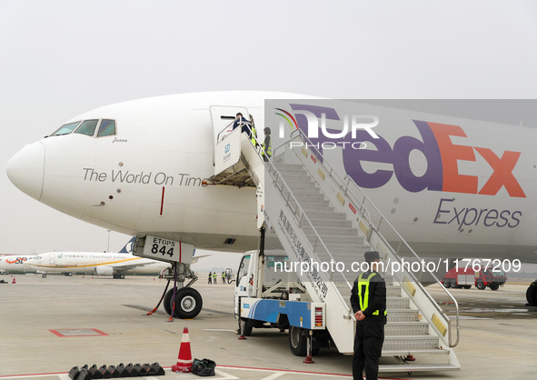 Flight FX5286 operated by FedEx lands at Qingdao Jiaodong International Airport in Qingdao, China, on November 11, 2024. 