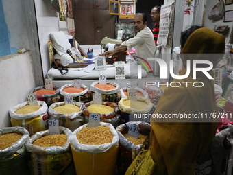 A customer buys pulses at a wholesale market in Kolkata, India, on November 11, 2024. India's consumer price inflation rises to a 14-month h...