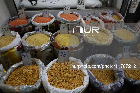 Sacks filled with pulses are seen with price tags at a wholesale market in Kolkata, India, on November 11, 2024. India's consumer price infl...