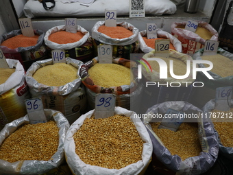 Sacks filled with pulses are seen with price tags at a wholesale market in Kolkata, India, on November 11, 2024. India's consumer price infl...