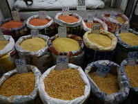 Sacks filled with pulses are seen with price tags at a wholesale market in Kolkata, India, on November 11, 2024. India's consumer price infl...