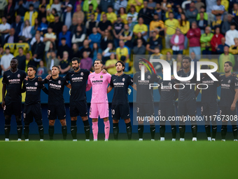 Villarreal CF players observe a minute's silence for the victims of the Valencia floodings before the LaLiga EA Sports match between Villarr...