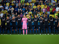 Villarreal CF players observe a minute's silence for the victims of the Valencia floodings before the LaLiga EA Sports match between Villarr...