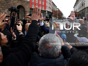 ''MRF - New Beginning'' party leader Delyan Peevski greets participants in the protest in front of the National Assembly on the first day of...