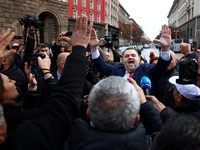 ''MRF - New Beginning'' party leader Delyan Peevski greets participants in the protest in front of the National Assembly on the first day of...