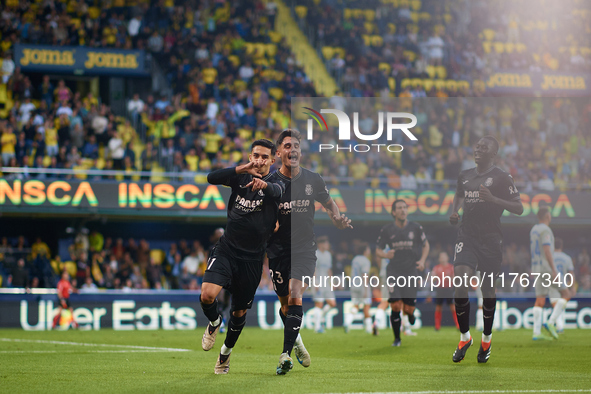 Ilias Akhomach of Villarreal CF celebrates after scoring the team's first goal next to his teammates Sergi Cardona and Gueye of Villarreal C...