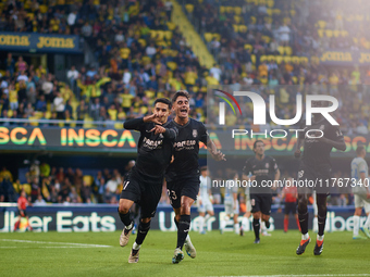 Ilias Akhomach of Villarreal CF celebrates after scoring the team's first goal next to his teammates Sergi Cardona and Gueye of Villarreal C...