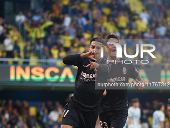 Ilias Akhomach of Villarreal CF celebrates after scoring the team's first goal next to his teammate Sergi Cardona of Villarreal CF during th...