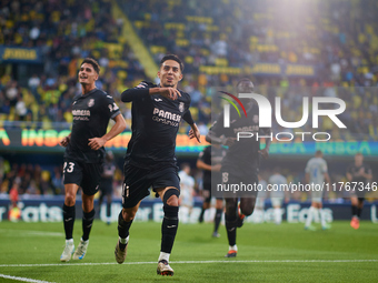 Ilias Akhomach of Villarreal CF celebrates after scoring the team's first goal next to his teammate Sergi Cardona and Gueye of Villarreal CF...