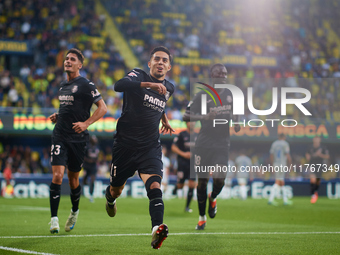 Ilias Akhomach of Villarreal CF celebrates after scoring the team's first goal next to his teammate Sergi Cardona and Gueye of Villarreal CF...