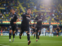 Ilias Akhomach of Villarreal CF celebrates after scoring the team's first goal next to his teammate Sergi Cardona and Gueye of Villarreal CF...