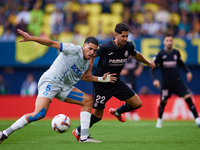 Ayoze (R) of Villarreal CF competes for the ball with Abdelkabir Abqar of Deportivo Alaves during the LaLiga EA Sports match between Villarr...