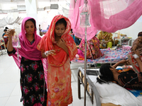 Patients suffering from dengue fever receive treatment inside the 'Shaheed Suhrawardy' Medical College Hospital in Dhaka, Bangladesh, on Nov...