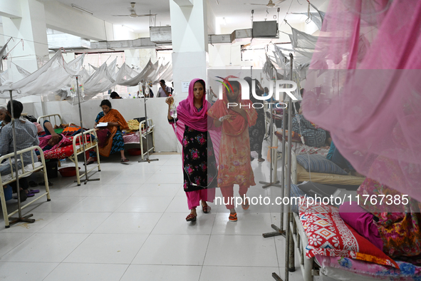 Patients suffering from dengue fever receive treatment inside the 'Shaheed Suhrawardy' Medical College Hospital in Dhaka, Bangladesh, on Nov...