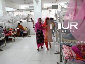 Patients suffering from dengue fever receive treatment inside the 'Shaheed Suhrawardy' Medical College Hospital in Dhaka, Bangladesh, on Nov...