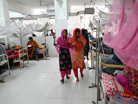 Patients suffering from dengue fever receive treatment inside the 'Shaheed Suhrawardy' Medical College Hospital in Dhaka, Bangladesh, on Nov...