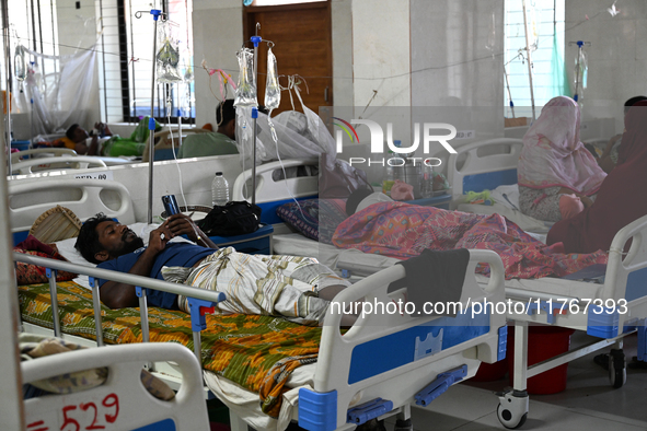 Patients suffering from dengue fever receive treatment inside the 'Shaheed Suhrawardy' Medical College Hospital in Dhaka, Bangladesh, on Nov...