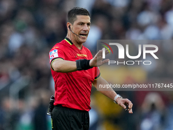 Referee Gianluca Manganiello gestures during the Serie A Enilive match between AS Roma and Bologna FC at Stadio Olimpico on November 10, 202...