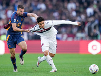 Bryan Cristante of AS Roma and Santiago Castro of Bologna FC compete for the ball during the Serie A Enilive match between AS Roma and Bolog...