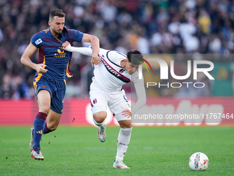 Bryan Cristante of AS Roma and Santiago Castro of Bologna FC compete for the ball during the Serie A Enilive match between AS Roma and Bolog...