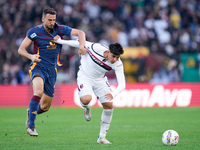 Bryan Cristante of AS Roma and Santiago Castro of Bologna FC compete for the ball during the Serie A Enilive match between AS Roma and Bolog...