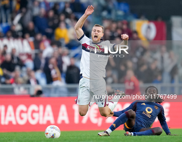 Manu Kone' of AS Roma and Tommaso Pobega of Bologna FC compete for the ball during the Serie A Enilive match between AS Roma and Bologna FC...