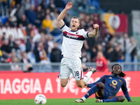 Manu Kone' of AS Roma and Tommaso Pobega of Bologna FC compete for the ball during the Serie A Enilive match between AS Roma and Bologna FC...