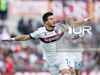 Riccardo Orsolini of Bologna FC celebrates after scoring second goal during the Serie A Enilive match between AS Roma and Bologna FC at Stad...