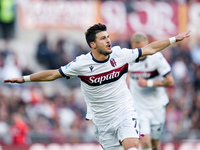 Riccardo Orsolini of Bologna FC celebrates after scoring second goal during the Serie A Enilive match between AS Roma and Bologna FC at Stad...