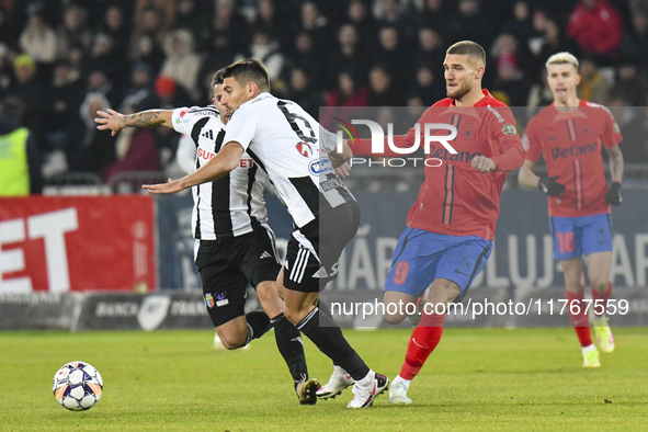 Iulian Cristea and Daniel Birligea are in action during the Superliga match between Universitatea Cluj and FCSB at Cluj Arena on November 10...