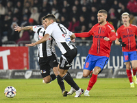 Iulian Cristea and Daniel Birligea are in action during the Superliga match between Universitatea Cluj and FCSB at Cluj Arena on November 10...