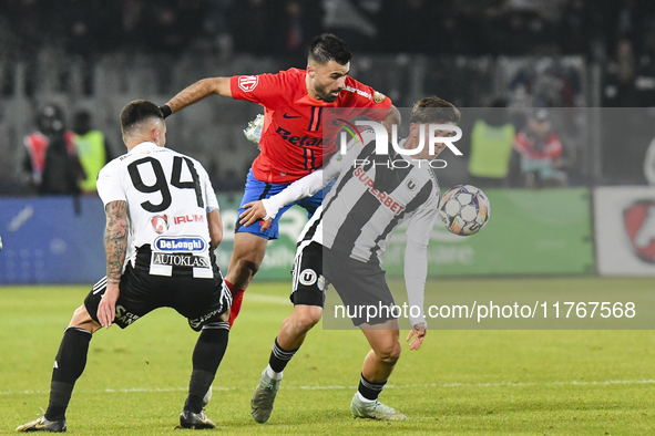 Valentin Cretu and Adrian Bota are in action during the Superliga match between Universitatea Cluj and FCSB at Cluj Arena in Cluj, Romania,...