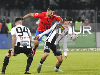 Valentin Cretu and Adrian Bota are in action during the Superliga match between Universitatea Cluj and FCSB at Cluj Arena in Cluj, Romania,...