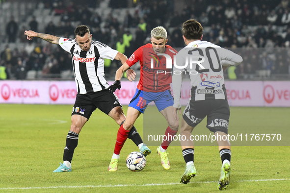 Dan Nistor and Ovidiu Popescu are in action during the Superliga match between Universitatea Cluj and FCSB at Cluj Arena in Cluj, Romania, o...