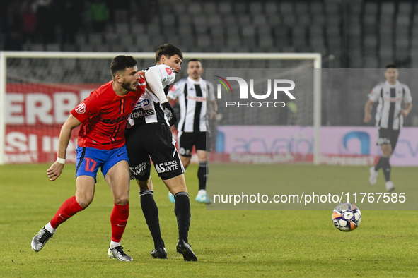 Vladislav Blanuta and Mihai Popescu are in action during the Superliga match between Universitatea Cluj and FCSB at Cluj Arena in Cluj, Roma...