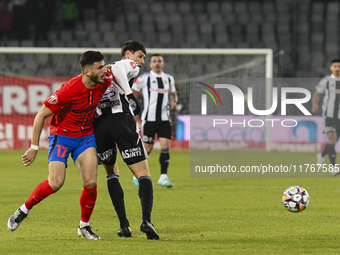 Vladislav Blanuta and Mihai Popescu are in action during the Superliga match between Universitatea Cluj and FCSB at Cluj Arena in Cluj, Roma...